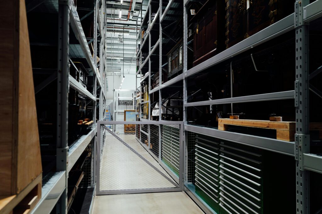 A detailed look at the interior of an industrial storage warehouse with metal shelves.