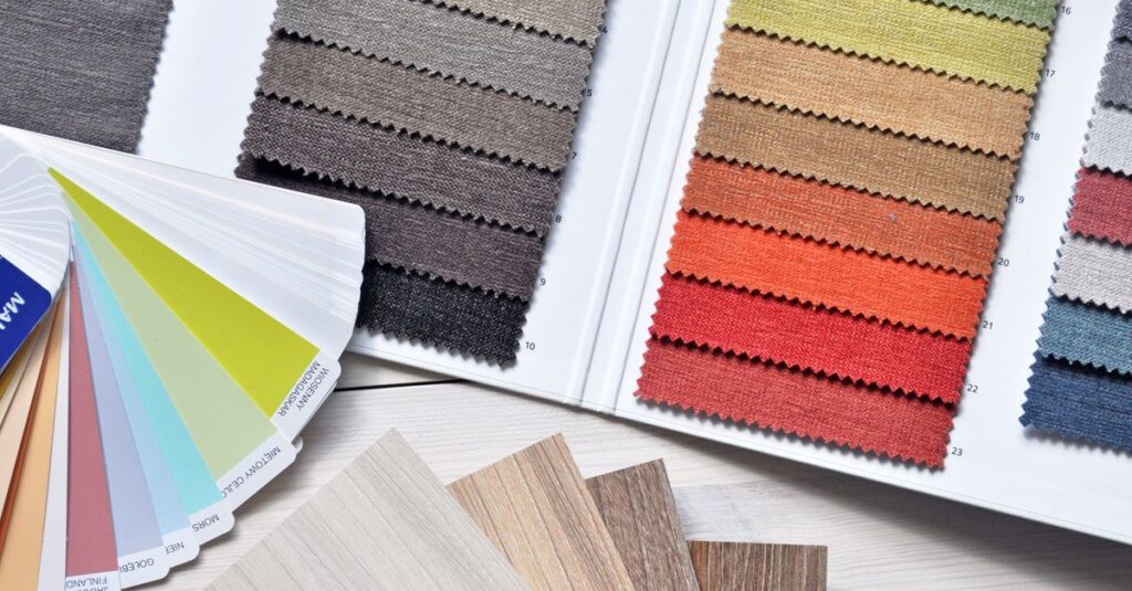 Colorful fabric and paint swatches laid out for design inspiration and material selection.