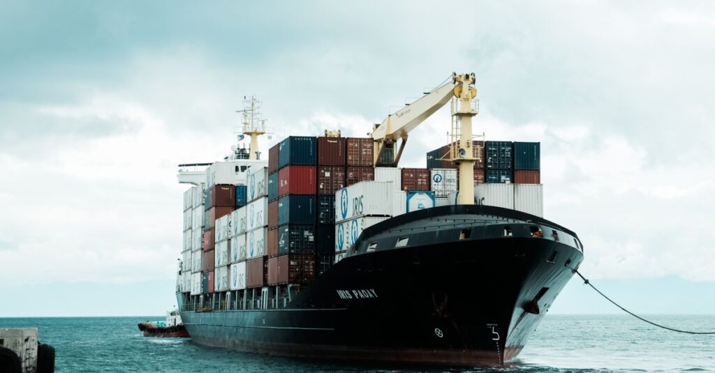 A large cargo ship loaded with shipping containers docked at Davao harbor, Philippines.