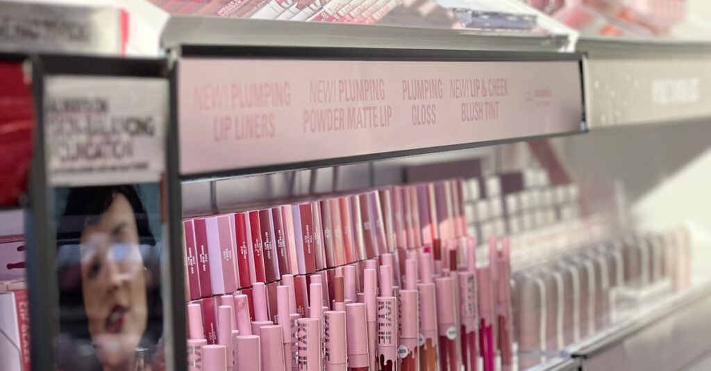 Vivid display of various lip products on shelves. Perfect for beauty and retail concepts.