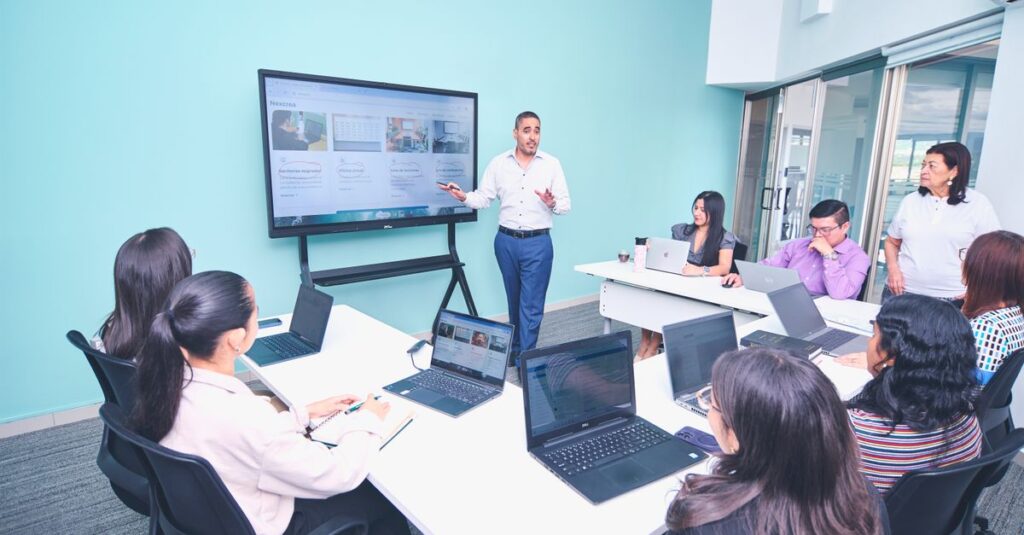 Team engaged in a presentation at a modern office using digital technology.