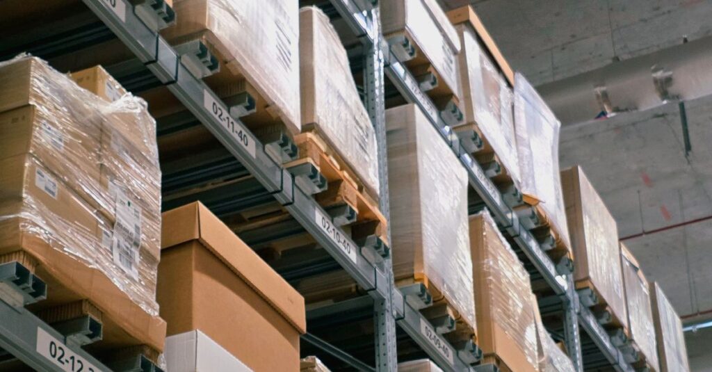 A warehouse showcasing organized shelves with stacked cardboard boxes for storage and logistics.