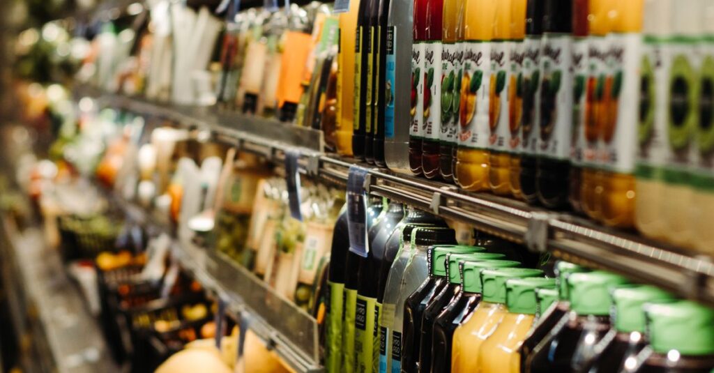 Vibrant array of bottled beverages on display in a Brazilian supermarket aisle.