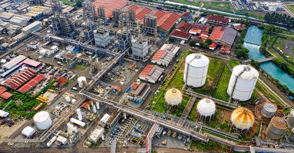 A detailed aerial view of an industrial facility in Banten, Indonesia, showcasing large tanks and architectural structures.