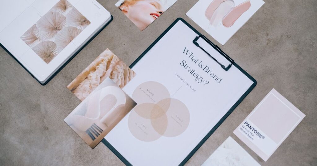 Flat lay showing branding materials and design concepts for creative strategy discussions.