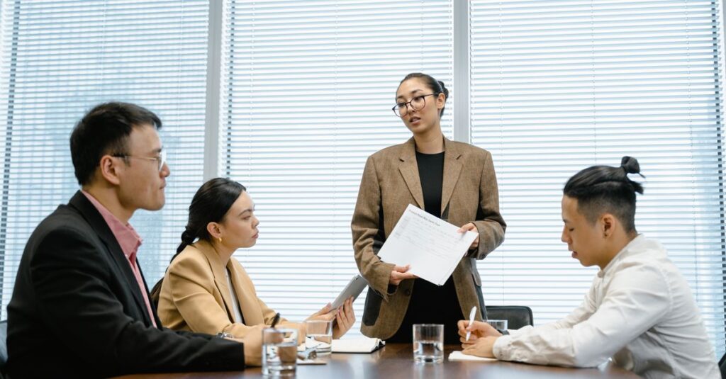 Business professionals in a modern office engaged in a teamwork session.
