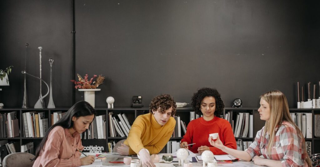 Diverse team collaborating in a stylish office space, focused on creative projects and strategy.