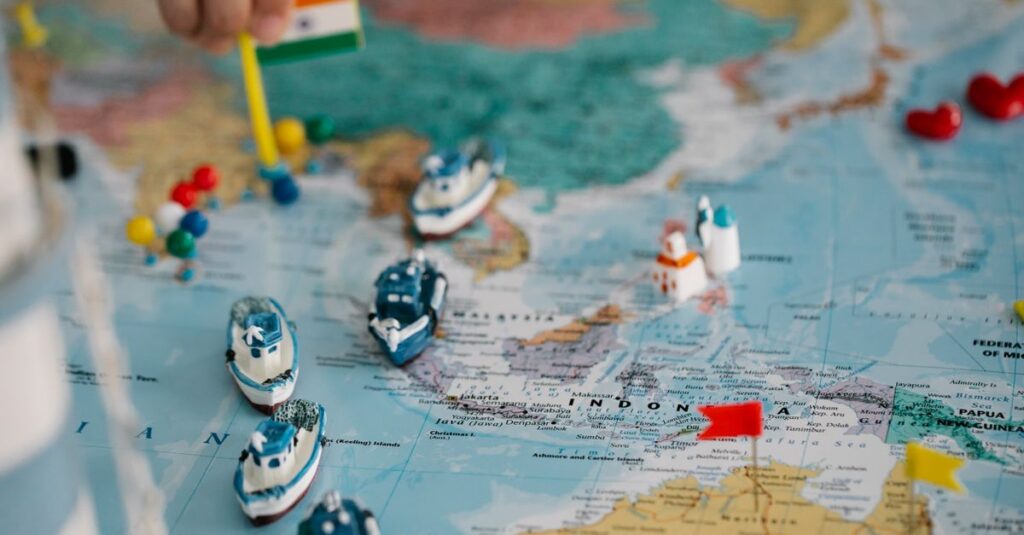 A detailed view of a world map with tiny model ships and flags indicating locations, highlighting global trade routes.
