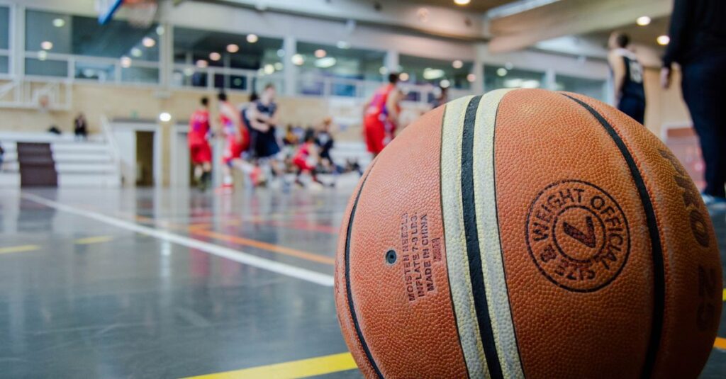 Captivating indoor basketball scene with players actively engaged in a game.